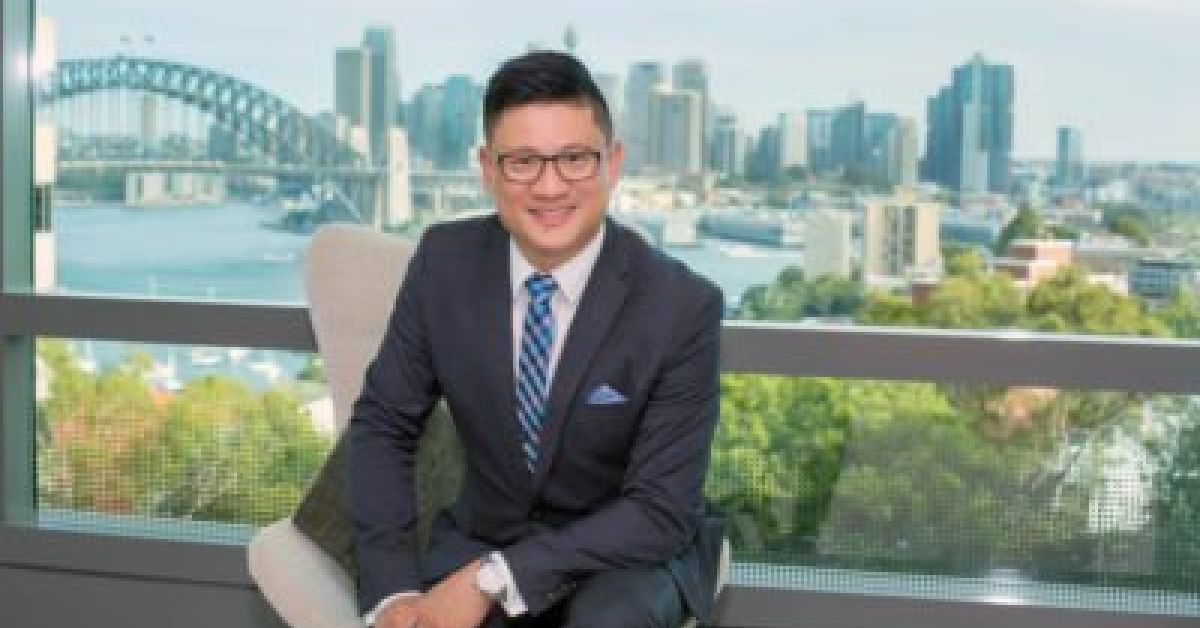 Portrait of Colin Lee behind Sydney Harbour
